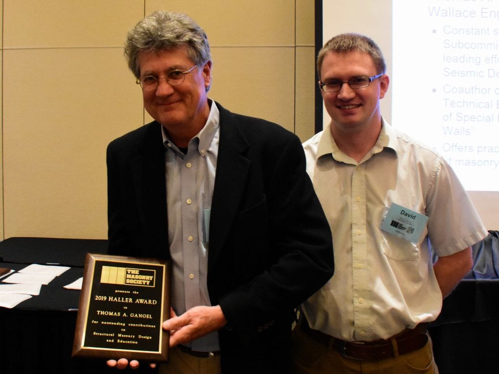 Tom Gangel (left) receives the 2019 Haller Award from David Sommer, Chair of the TMS's Design Practices Committee